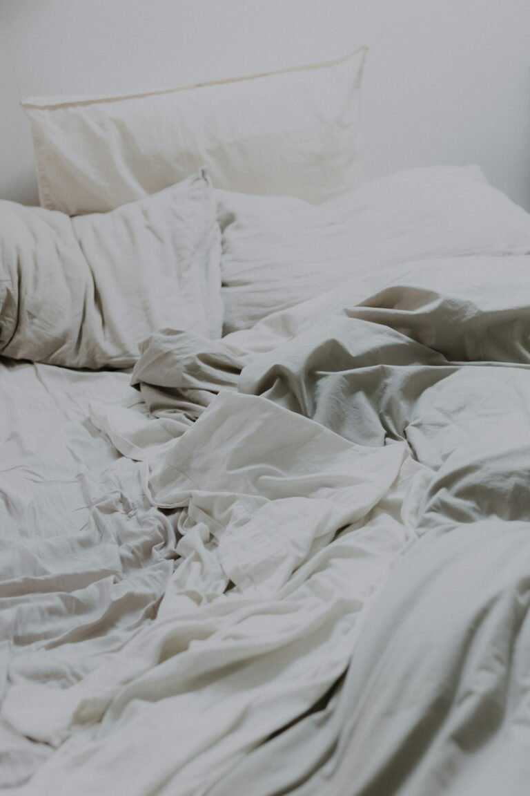 Soft cotton bedding styled on a cozy bed
