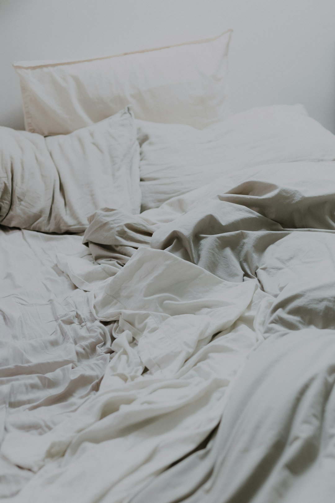 Soft cotton bedding styled on a cozy bed