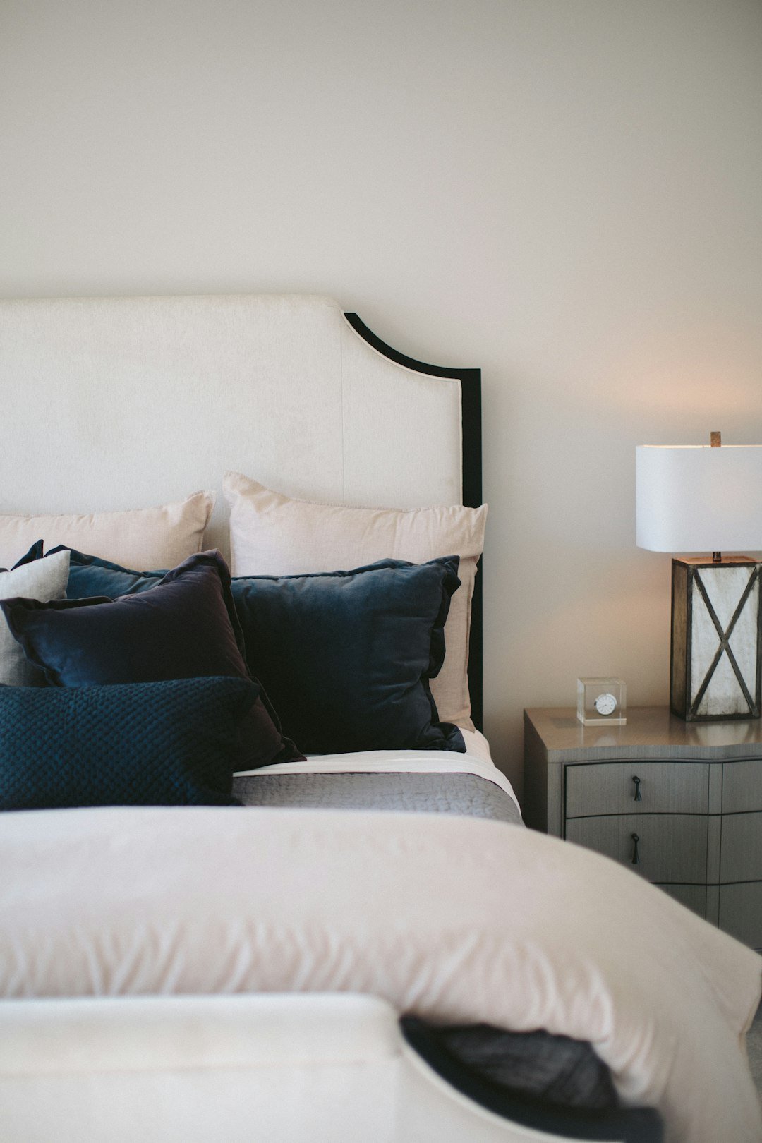 Upholstered leaning headboard in a cozy bedroom