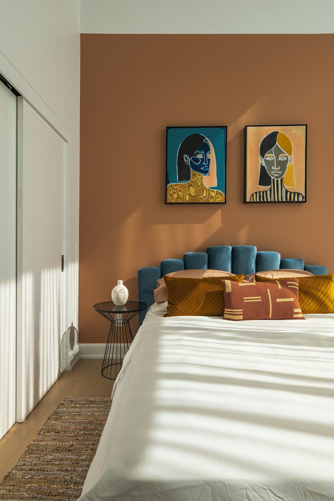 Warm muted color palette in a small bedroom