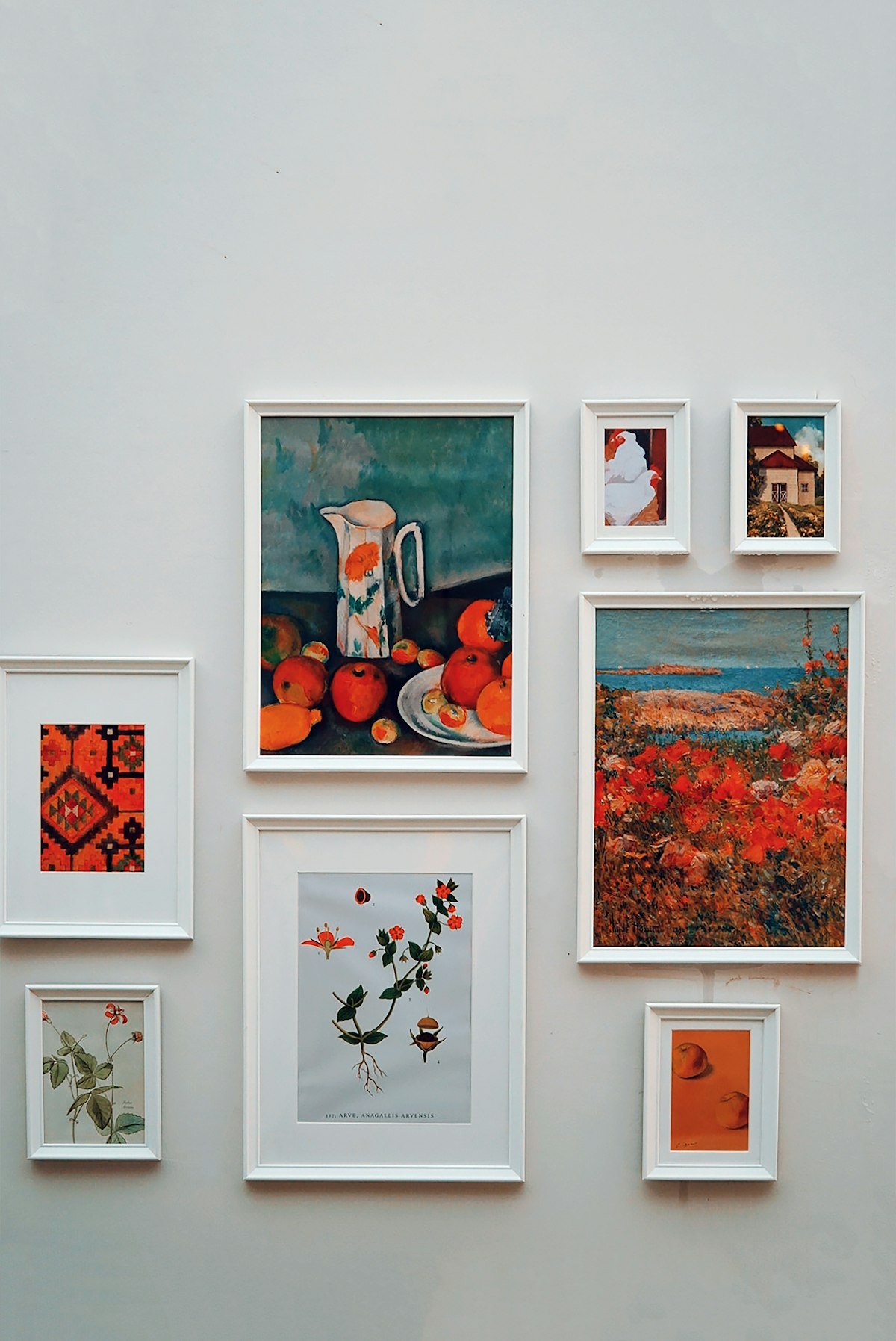 A bunch of pictures hanging on a wall