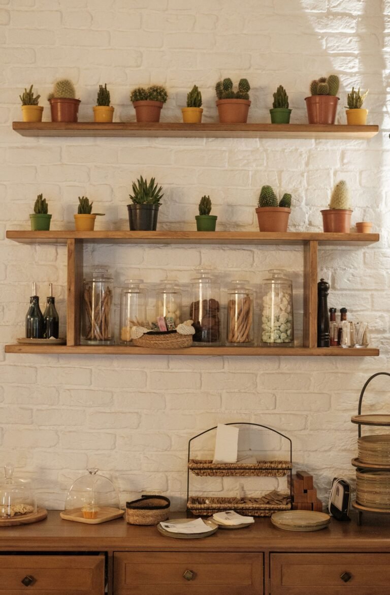 Warm indoor scene with wooden wall shelves holding cactus plants and wooden decor against a brick wall — vertical storage ideas
