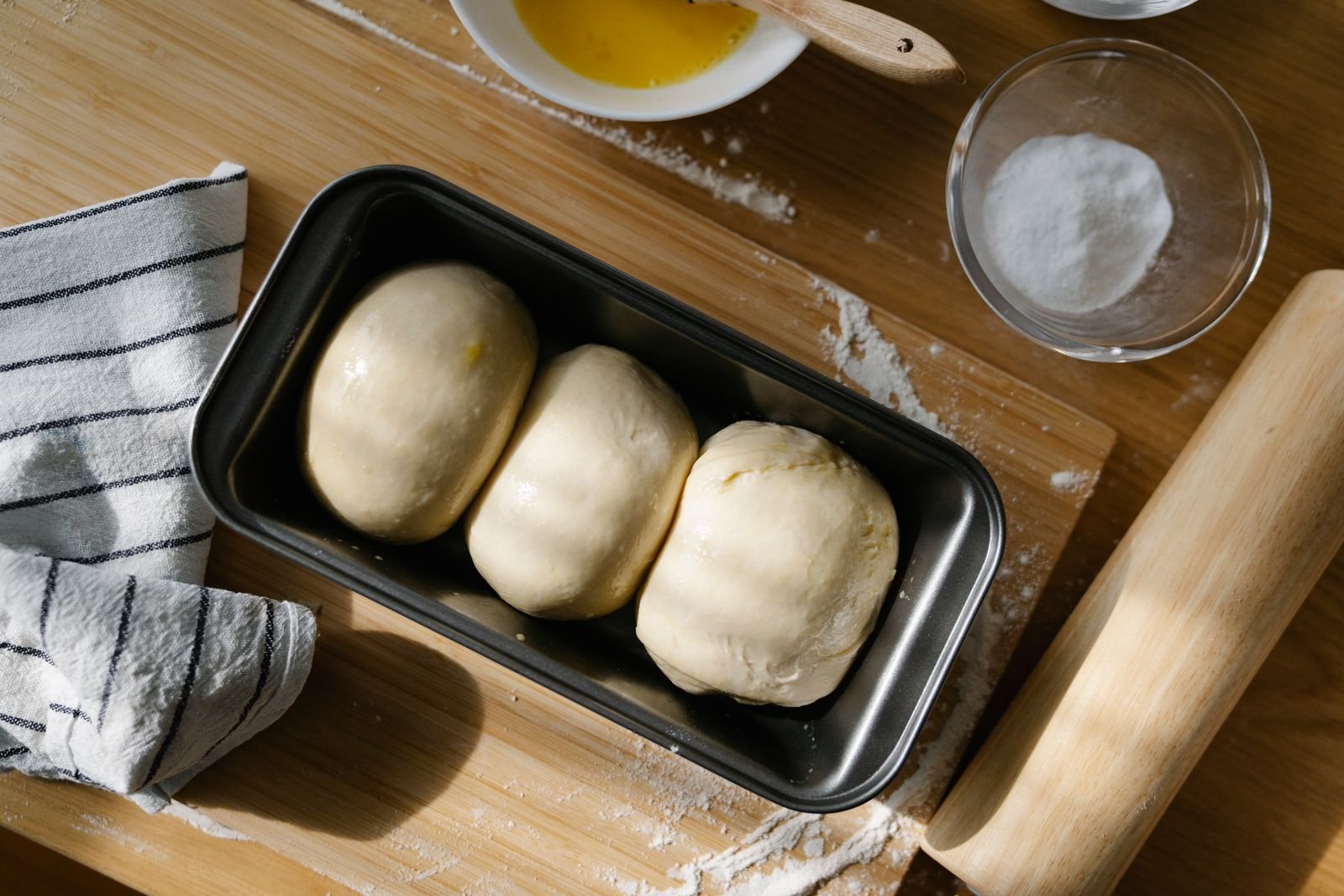 Dough resting in a tray as a portable prep station — small kitchen cooking ideas