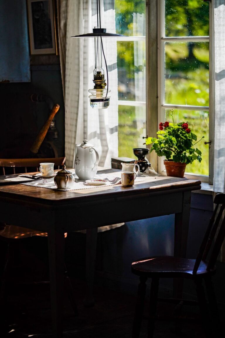Cozy kitchen counter with a coffee cup and breakfast bowl in soft morning light — cozy small kitchen breakfast ideas