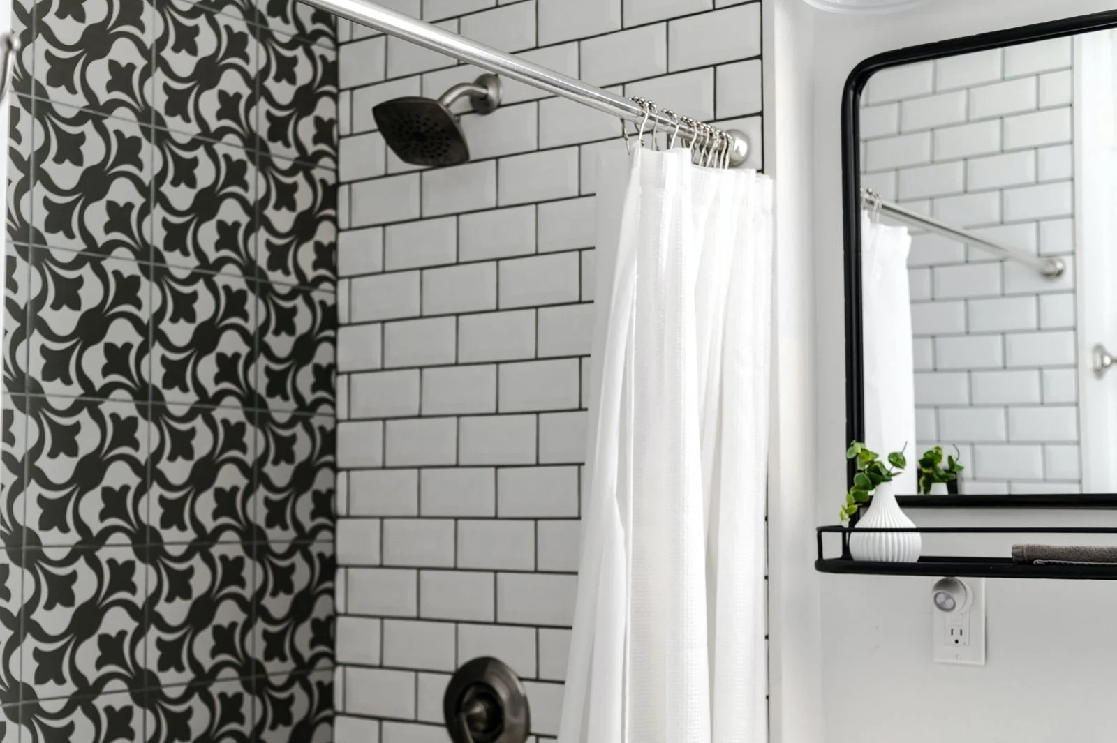 Contemporary bathroom with patterned and subway tiles and a white shower curtain — a high and wide curtain idea for a small shower