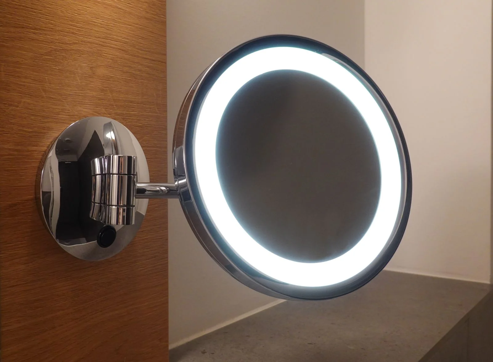 Bright light of a lamp shining in a bedroom with soft pillows on the bed in the evening; inviting bedroom interior with a glowing bedside lamp and cozy textiles — 4. a warm led strip behind the headboard