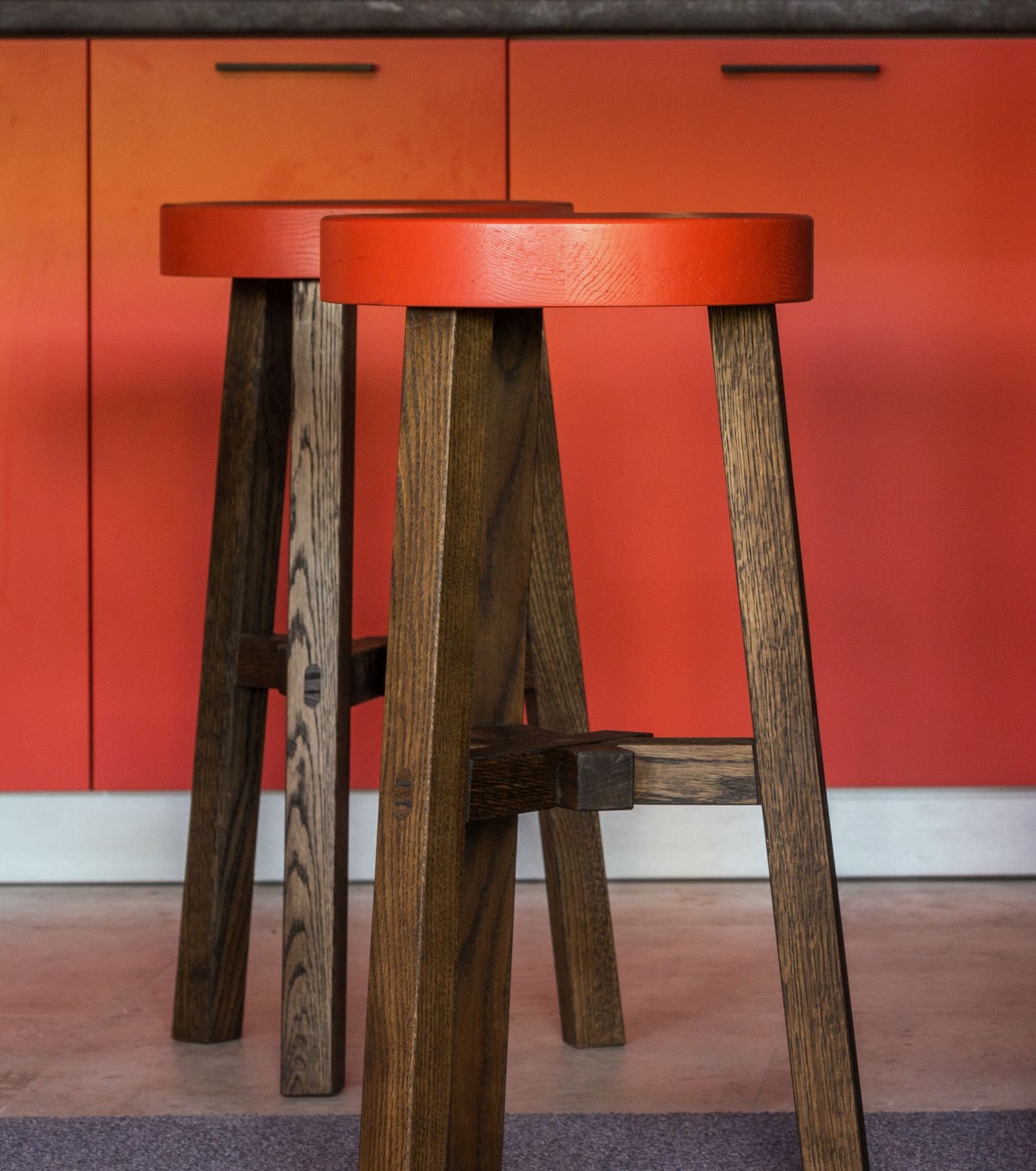 Child standing on a sturdy stool at a safe kitchen station — cooking with kids safely in a small kitchen