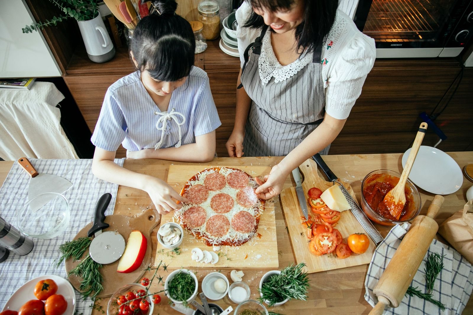 Hot pan kept on the back burner with handle turned in — kid-safe small kitchen cooking