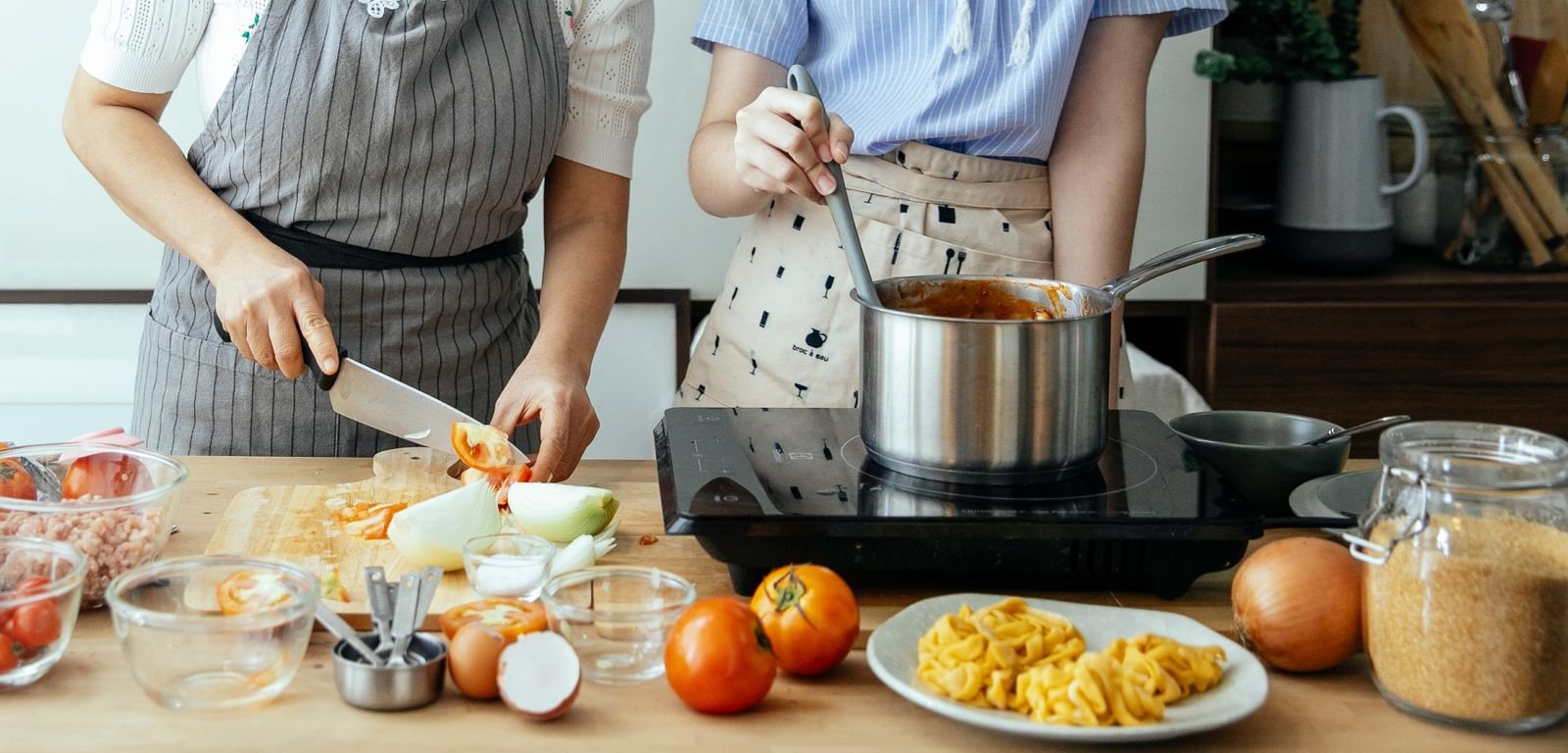 Sturdy non-slip step stool at a kitchen counter — kid-safe small kitchen cooking